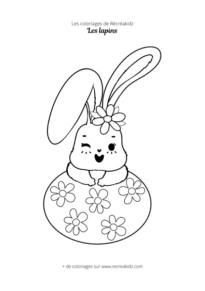 Coloriage de lapin avec oeuf et fleurs