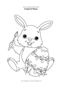 Coloriage lapin de Pâques qui peint